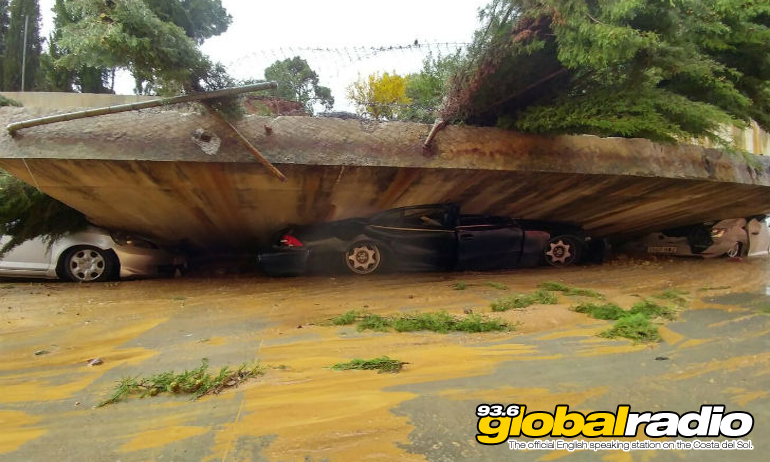 Cars crushed under a collapsed bridge near La Linea